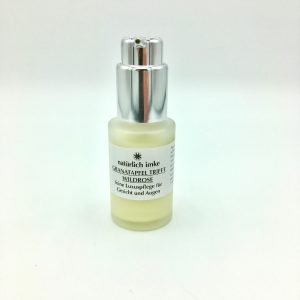 Der opake, runde 30ml-Glasflakon mit silberfarbenem Pumpspender enthält eine gelbliche Creme.