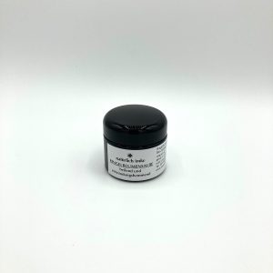 Die 50ml-Violettglaskruke mit schwarzem Deckel hat einen gelben, festen Inhalt.